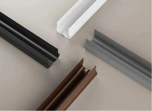 Four profiles in white, gray, black, and brown on a neutral background