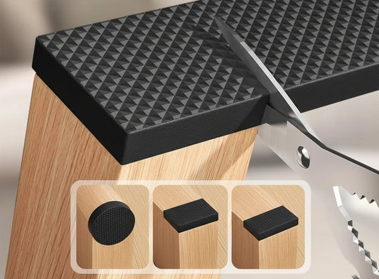 Black textured cutting mat on a wooden surface with text about customizable sizes and shapes.