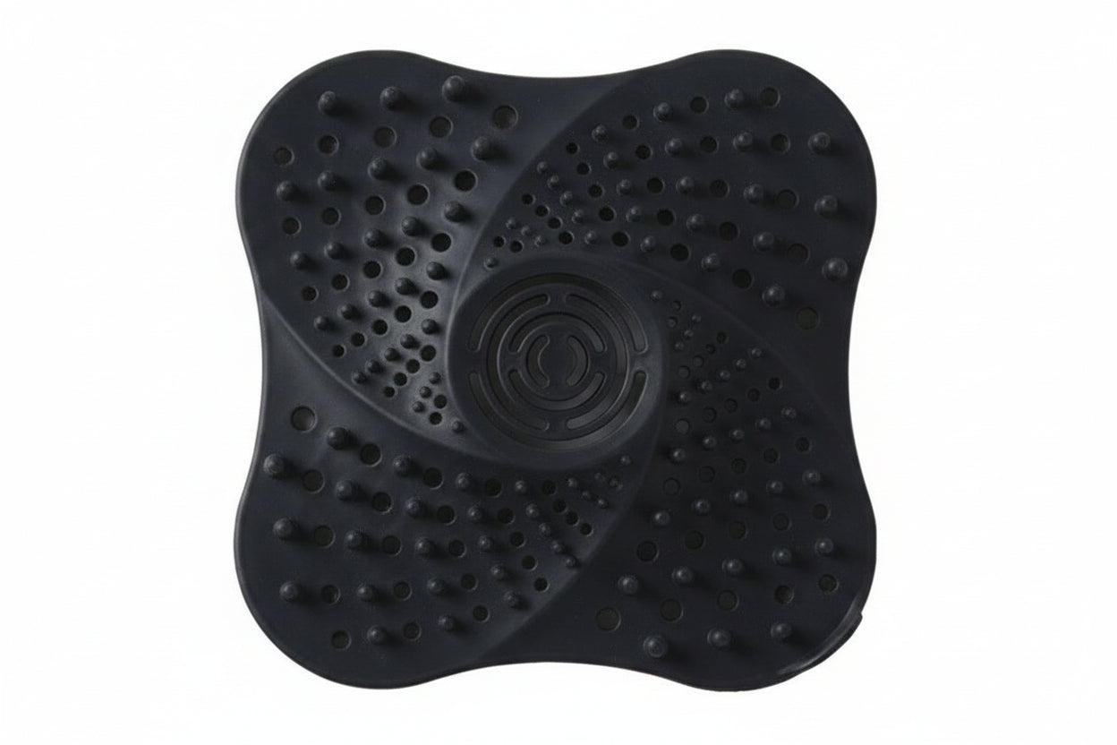 Black, white, and blue silicone drain cover on a white background